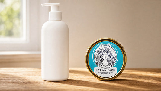 A plain lotion pump bottle next to the Eat My Face Original tallow tin on a kitchen counter