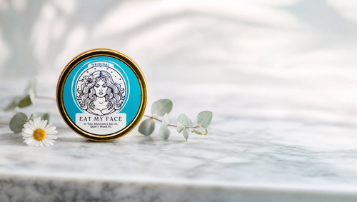 Eat My Face Original tallow moisturizer tin on clean marble — is beef tallow non-comedogenic