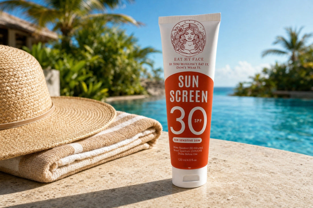 Eat My Face SPF 30 sunscreen tube poolside with a straw sun hat and beach towel, turquoise infinity pool and palms behind