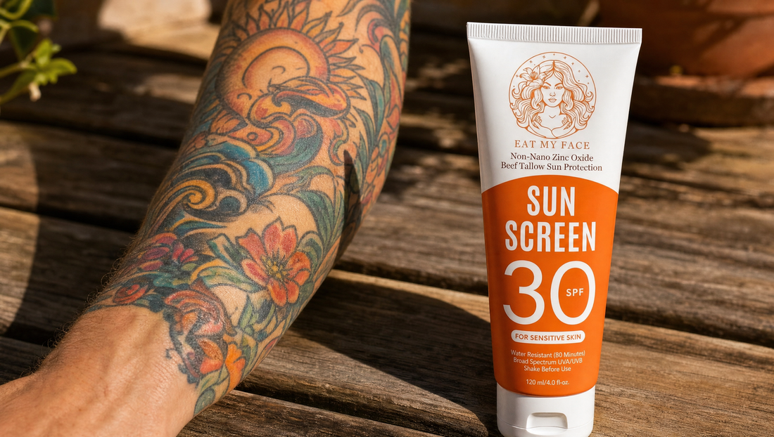 Eat My Face SPF 30 beef tallow sunscreen tube beside a colorful tattoo sleeve — best tallow sunscreen for tattoos