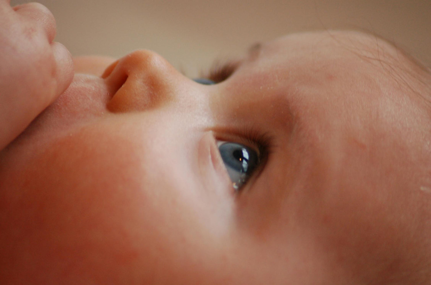 non-toxic tallow baby lotion for gentle moisture on sensitive skin, close-up of baby face and eye