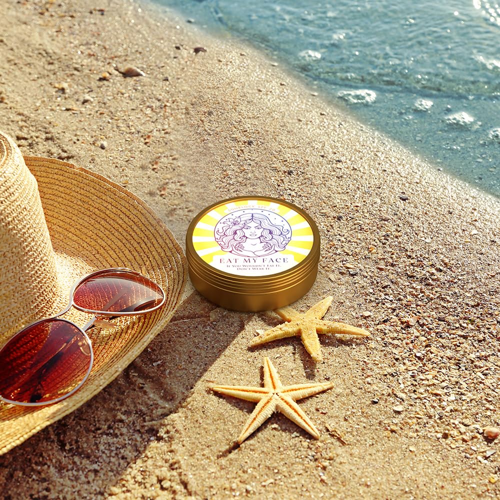 Beef Tallow Sunscreen SPF 30 - Reef Safe tin on sandy beach by ocean with straw hat, sunglasses, and starfish