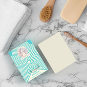 Alt Tag: unscented tallow soap bar on marble countertop with towel, wooden brush, and soap box for fragrance-free sensitive skin care